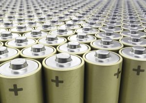 A landscape of batteries standing side by side like on a assembly line.